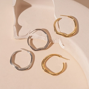 Irregular geometric circle earrings with liquid metal texture in gold and silver finish