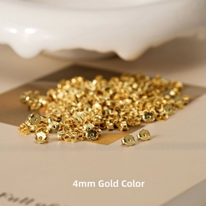 Detail of 4mm gold plated S925 sterling silver earring backs with engraved hallmarks