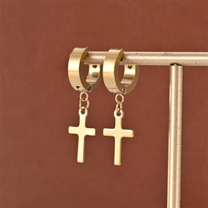 Detail of 18K gold-plated cross hoop earrings displayed on a metallic jewelry stand