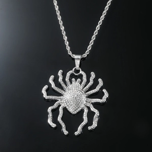Macro shot of silver hip-hop spider pendant with full diamond setting on a rope chain