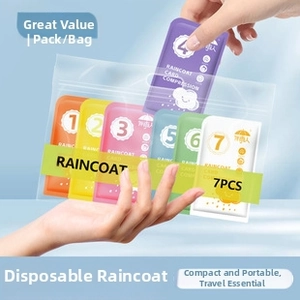 Detail view of 7-pack portable compressed card raincoats in multiple vibrant colors