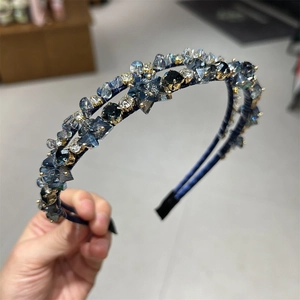 Detailed close-up of double-layered blue crystal headband with hand-set beads