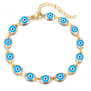 Detailed macro shot of golden Evil Eye bracelet featuring blue enamel charms and clasp