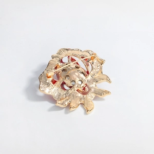 Vintage crystal rose brooch in gold metal finish with secure pin back mechanism