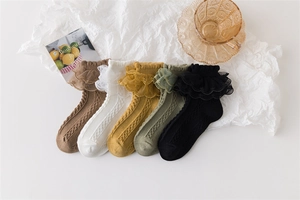 Five pairs of kids' cotton lace socks in assorted colors with cable knit textures