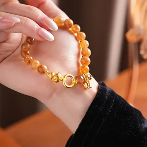 Bracciale di perle in citrino con charm Pixiu dorato e campanellino in stile neo-cinese