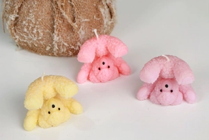 Close-up of cute cartoon bear aromatherapy candles with detailed plush texture in pastel colors