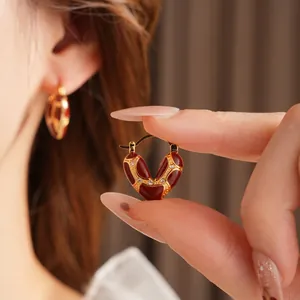 Luxury heart hoop earrings with red enamel and crystals in gold plated finish