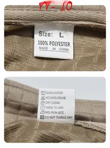Detail of the washing label on khaki waffle knit fabric for polyester men top