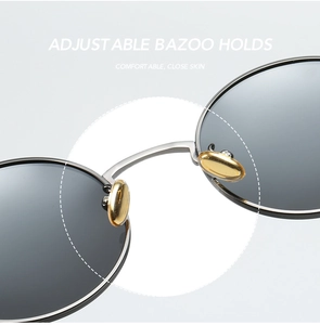 Detail shot of adjustable golden nose pads and silver metal bridge on polarized sunglasses