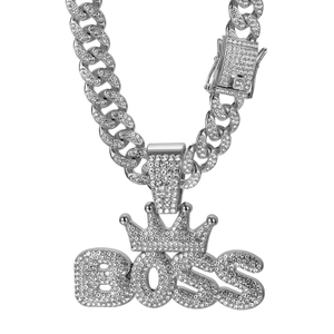 Detailed close-up of silver Cuban chain necklace featuring BOSS pendant with crown and CZ stones