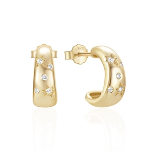 Detailed view of gold S925 silver C-shape earrings with star engraving and white zircon