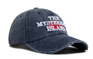 Close-up of embroidered letters and distressed brim on navy washed cotton baseball cap