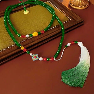 Retro beaded flower necklace with green pearls, blue enamel pendant and silk tassel