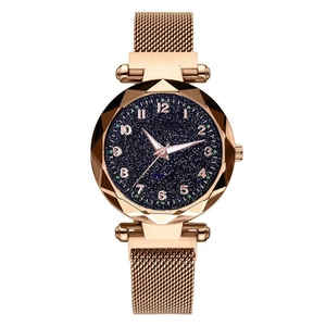 Close-up of starry sky dial with Arabic numerals and rose gold magnetic mesh strap
