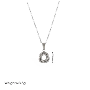 Macro view of 13mm interlocking ring pendant and weight measurement on silver necklace