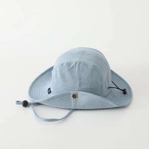 Detail of light blue denim bucket hat with side metal snaps and adjustable windproof cord