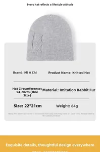 Detail of light grey faux rabbit fur beanie showing 54-60cm sizing and knit texture