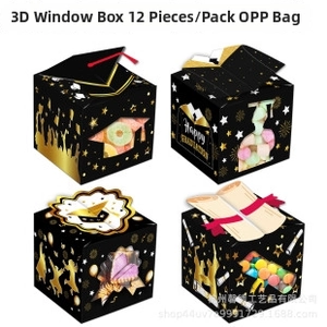 Macro view of graduation gift boxes with gold stars and mortarboard icons on black paper