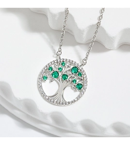 Detailed close-up of Tree of Life pendant with green gemstones and white cubic zirconia