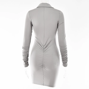 Rear view of grey long-sleeved bodycon dress showing ruched detail and slim fit tailoring