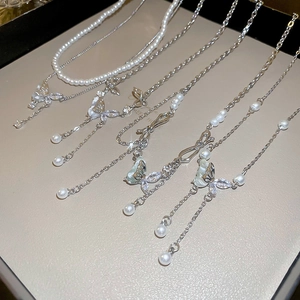 Elegant Y2K butterfly necklace with silver chain, white pearls and zircon tassels
