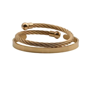Men's gold stainless steel open twisted cuff and flat bangle bracelet set on white background