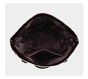 Vue de dessus de l'intérieur du sac cabas avec compartiments multiples et poches zippées