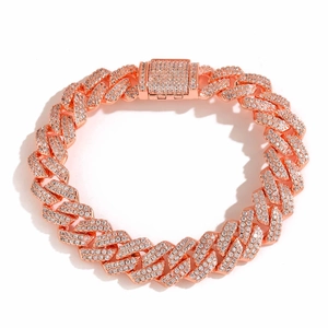 Macro detail of rose gold Cuban link chain with paved shimmering cubic zirconia stones