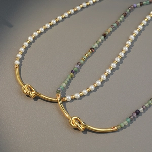Bohemian beaded necklace with gold knotted metal, natural stones, and white pearls