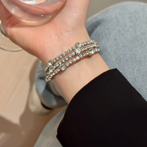 Luxurious multi-layer silver rhinestone bracelet for women featuring three rows of crystals