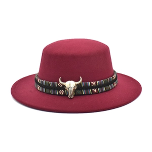 Flat top wine red wool fedora hat with ethnic band and golden bull skull metal detail