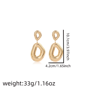 Product dimensions showing 10.1cm height and 4.2cm width on golden metal drop earrings