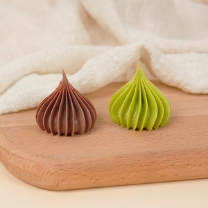 Miniature lifelike chocolate and matcha swirl cream dollhouse accessories on wooden base