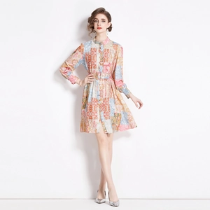 Elegant vintage patchwork print midi dress with long sleeves and belted waist silhouette