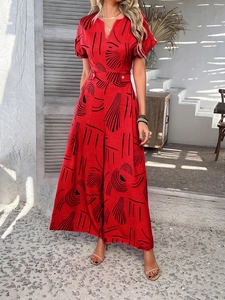 Detail of red floral V-neck jumpsuit with short sleeves and wide-leg trousers design