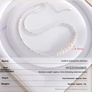 Detail view of S925 sterling silver smile necklace with gradient freshwater pearls