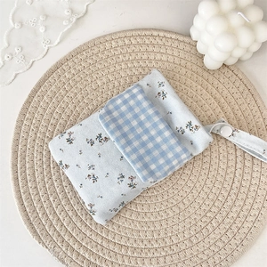 Macro detail of blue floral multi-purpose nurse pen pocket on a woven mat