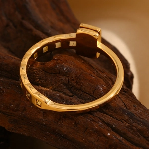 Detailed macro view of an 18K gold-plated geometric ring with square cut-out design