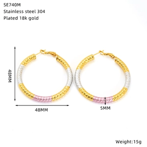 Detail view of 48mm tricolor stainless steel hoop earrings with size specifications