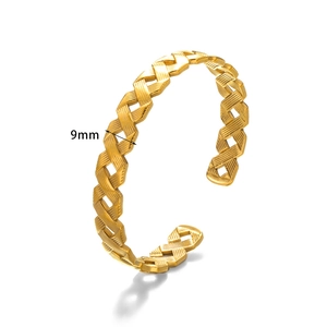 Detail of 9mm gold stainless steel cuff bracelet with woven texture and hollow design