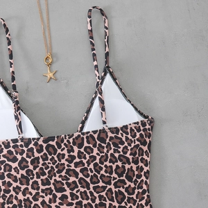 Close-up of leopard print swimsuit with adjustable straps and v-neckline detail