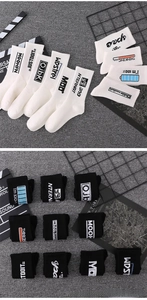 Detailed knit texture of athletic crew socks featuring battery power and slider prints