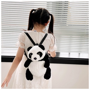 Rear view of a young girl wearing a large plush panda backpack with high-quality soft fur