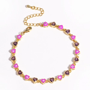 Detail of gold heart link bracelet with purple zircon and pink evil eye enamel charms
