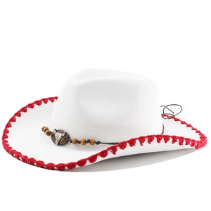 Detail of white western cowboy hat with red stitching and bull skull bead band decor