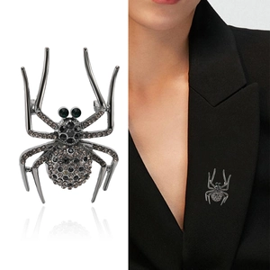 Vintage rhinestone spider brooch for men's suits shown in detail and on a model