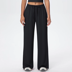Detail view of women's black wide-leg trousers with adjustable drawstring elastic waistband