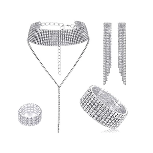 Detail view of silver bridal jewelry set with sparkling rhinestones and long fringe tassels