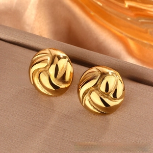 Close-up of golden waterdrop button earrings with spiral texture and 18K gold finish